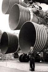 Wernher von Braun in front of the Saturn V engines