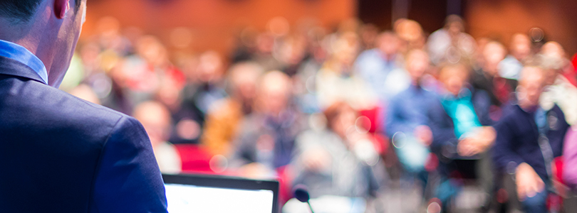 Speaker in front of an audience